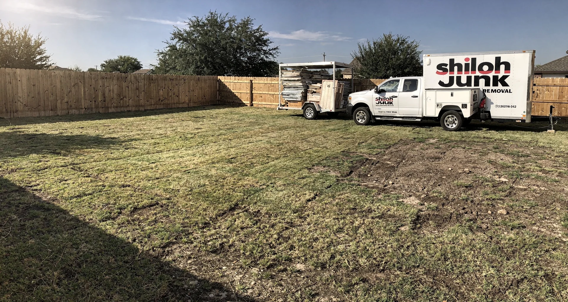 Clean open backyard lawn area with shed fully dismantled and debris cleared